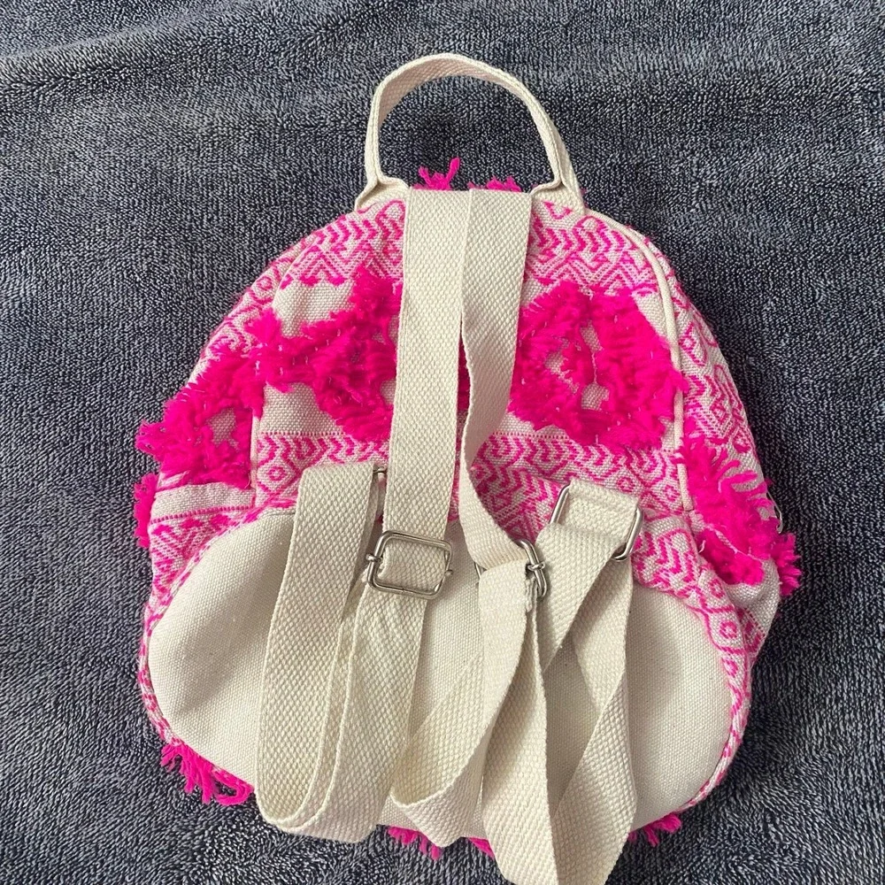 Boho fringe mini backpack‎ in neon pink and coral canvas.